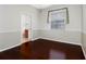 Hardwood floors grace this bedroom, located close to the ensuite bathroom at 16522 Ivy Lake Dr, Odessa, FL 33556
