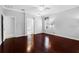 Bright bedroom with gleaming hardwood floors and adjacent bathroom and walk-in closet at 16522 Ivy Lake Dr, Odessa, FL 33556
