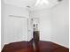 Bedroom with hardwood floors, closet with sliding doors, and a ceiling fan at 16522 Ivy Lake Dr, Odessa, FL 33556