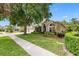 Exterior view of a well maintained house, showcasing a lush green lawn and landscaping at 16522 Ivy Lake Dr, Odessa, FL 33556