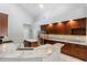 Kitchen featuring stainless steel appliances, granite countertops, island, and sleek design at 16522 Ivy Lake Dr, Odessa, FL 33556