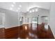 Spacious living room with gleaming hardwood floors, high vaulted ceilings, and abundant natural light at 16522 Ivy Lake Dr, Odessa, FL 33556