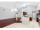Open-concept home with hardwood floors and bright kitchen in view at 16522 Ivy Lake Dr, Odessa, FL 33556