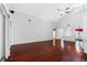 Bright living room features hardwood floors, vaulted ceilings, and neutral wall color at 16522 Ivy Lake Dr, Odessa, FL 33556