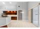 Open space with kitchen, dining area, and sliding doors at 16522 Ivy Lake Dr, Odessa, FL 33556