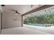 Covered patio offering a glimpse of the screened-in pool, spa, and outdoor living space at 16522 Ivy Lake Dr, Odessa, FL 33556