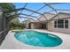 Large screened-in pool with an attached spa, ideal for relaxation and outdoor entertainment at 16522 Ivy Lake Dr, Odessa, FL 33556