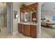 Bathroom featuring custom cabinets, large mirror, and glass enclosed shower at 1737 Brightwaters Ne Blvd, St Petersburg, FL 33704