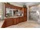Bathroom featuring custom cabinets, large mirror, and glass enclosed shower at 1737 Brightwaters Ne Blvd, St Petersburg, FL 33704