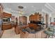 Large kitchen features custom cabinets, granite counters, an island, and high-end appliances at 1737 Brightwaters Ne Blvd, St Petersburg, FL 33704