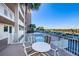 Balcony featuring seating, with views of the community pool and parking at 18650 Gulf Blvd # 601, Indian Shores, FL 33785