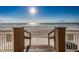 Direct beach access with wooden stairs leading down to the sandy shore at 18650 Gulf Blvd # 601, Indian Shores, FL 33785