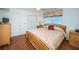 Cozy bedroom with wood floors, a queen-sized bed, and a large window offering serene ocean views at 18650 Gulf Blvd # 601, Indian Shores, FL 33785
