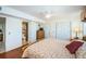 Comfortable bedroom with ceiling fan, ensuite bath, closet and flat screen TV at 18650 Gulf Blvd # 601, Indian Shores, FL 33785