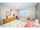 Bedroom featuring twin beds, shuttered window and a view of the ocean at 18650 Gulf Blvd # 601, Indian Shores, FL 33785