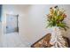 Bright entryway features tiled floors, a gray front door and beachy decor, creating an inviting welcome at 18650 Gulf Blvd # 601, Indian Shores, FL 33785