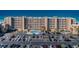Oceanfront condo building featuring a swimming pool, parking, and direct beach access at 18650 Gulf Blvd # 601, Indian Shores, FL 33785