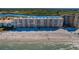 A scenic aerial view showcasing the beachfront condo building with pristine beach access at 18650 Gulf Blvd # 601, Indian Shores, FL 33785