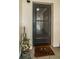 Dark colored front door with peephole and welcome mat at 18650 Gulf Blvd # 601, Indian Shores, FL 33785