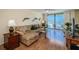 Cozy living room featuring a comfortable sofa, stylish decor, and abundant natural light at 18650 Gulf Blvd # 601, Indian Shores, FL 33785