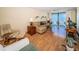 Inviting living room with ample seating, wood-look flooring, and large windows for natural light at 18650 Gulf Blvd # 601, Indian Shores, FL 33785
