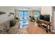Bright living room with sliding glass door to the ocean-view balcony and coastal decor at 18650 Gulf Blvd # 601, Indian Shores, FL 33785