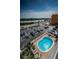 An aerial view overlooking the in-ground pool, parking area and Intracoastal Waterway at 18650 Gulf Blvd # 601, Indian Shores, FL 33785