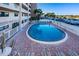 Condo outdoor pool with lounge area and chairs at 18650 Gulf Blvd # 601, Indian Shores, FL 33785