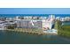 Waterfront condo building with docks, pool, and ocean views at 19451 Gulf Blvd # 211, Indian Shores, FL 33785