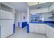 Bright kitchen adjacent to a dining area at 19451 Gulf Blvd # 211, Indian Shores, FL 33785