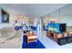 Open floor plan showcases tile flooring, mirrored wall, and comfortable living room furnishings at 19451 Gulf Blvd # 211, Indian Shores, FL 33785