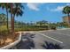 View of the community parking lot with landscaping and nearby amenities at 19451 Gulf Blvd # 211, Indian Shores, FL 33785