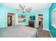 Bright bedroom with a modern ceiling fan, carpeted floors, and ample natural light at 1965 Allard Dr, Clearwater, FL 33763
