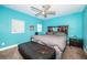Bright bedroom with a modern ceiling fan, carpeted floors, and ample natural light at 1965 Allard Dr, Clearwater, FL 33763