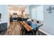 Eat-in kitchen with dark cabinets on the lower level, white upper cabinets, and a wood and epoxy table at 1965 Allard Dr, Clearwater, FL 33763