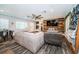 Open concept living room with an eat-in space and rustic wood accent wall at 1965 Allard Dr, Clearwater, FL 33763