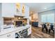 Built in office space with granite countertops, custom cabinetry, and hardwood floors at 1965 Allard Dr, Clearwater, FL 33763