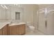 Well-lit bathroom with shower, sink, and tiled flooring at 20305 Oak Key Ct, Tampa, FL 33647