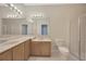Bathroom with double sinks, shower, and tiled flooring at 20305 Oak Key Ct, Tampa, FL 33647