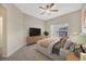 Cozy bedroom with a ceiling fan, natural light, and comfortable furnishings at 20305 Oak Key Ct, Tampa, FL 33647