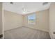 Bedroom featuring neutral walls, gray carpet, a ceiling fan, and a view out the window at 20305 Oak Key Ct, Tampa, FL 33647