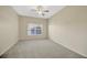 Spacious bedroom featuring carpet flooring, a ceiling fan and a window at 20305 Oak Key Ct, Tampa, FL 33647