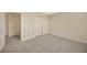 Carpeted bedroom featuring double closets, and neutral decor at 20305 Oak Key Ct, Tampa, FL 33647