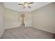 Spacious bedroom with neutral walls, carpet, and a ceiling fan at 20305 Oak Key Ct, Tampa, FL 33647