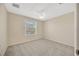 Empty bedroom with neutral carpeting, a ceiling fan, and a bright window at 20305 Oak Key Ct, Tampa, FL 33647