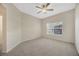 Spacious bedroom featuring carpet flooring, a ceiling fan and a window at 20305 Oak Key Ct, Tampa, FL 33647