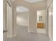 Bedroom entry featuring carpet flooring, white walls and a bathroom across the hall at 20305 Oak Key Ct, Tampa, FL 33647