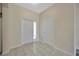 Bright foyer with tile floors, closet, and bright white paint at 20305 Oak Key Ct, Tampa, FL 33647