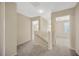 Hallway showing neutral walls, gray carpet, and white trim, and leading to other rooms at 20305 Oak Key Ct, Tampa, FL 33647