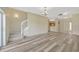 Spacious living room with stairs, vinyl flooring and light fixtures at 20305 Oak Key Ct, Tampa, FL 33647